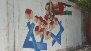 İsrail'in ilhak kararını grafiti çizerek protesto etiler