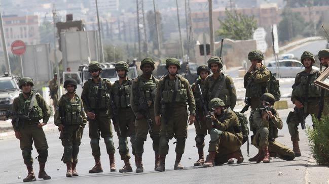 srail askerleri 21 Filistinliyi gzaltna ald 