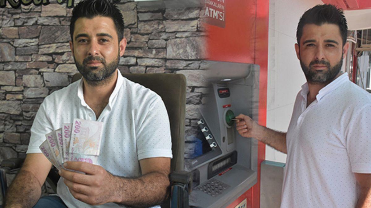 Tatil'de ATM'de unutulan parann sahibini arayan adam takdir toplad