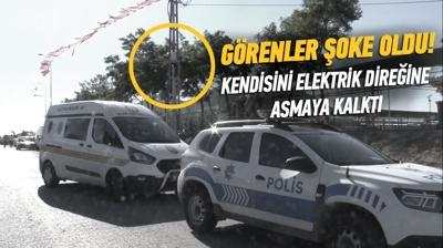 Sokak ortasndaki elektrik direine kendini asmaya alt! Sebebini renenler oke oldu