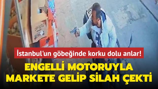 stanbul'un gbeinde korku dolu anlar! Engelli motoruyla markete gelip silah ekti