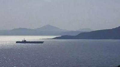 Kom�uda ABD casusu alarm�! Aylard�r foto�raflar�n� �ekmi�