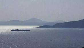 Kom�uda ABD casusu alarm�! Aylard�r foto�raflar�n� �ekmi�