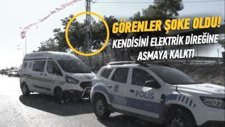 Sokak ortasndaki elektrik direine kendini asmaya alt! Sebebini renenler oke oldu
