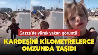 Gazze'de yrek yakan grnt! Minik kz kardeini kilometrelerce omzunda tad