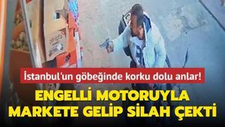 stanbul'un gbeinde korku dolu anlar! Engelli motoruyla markete gelip silah ekti