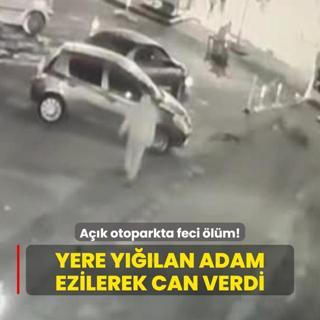 Ak otoparkta feci lm: Yere ylan adamn zerinden otomobil geti