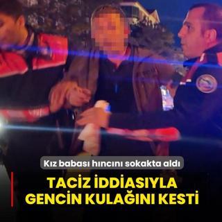 K�z babas� h�nc�n� sokakta ald�: Taciz etti�i iddia edilen gencin kula��n� kesti