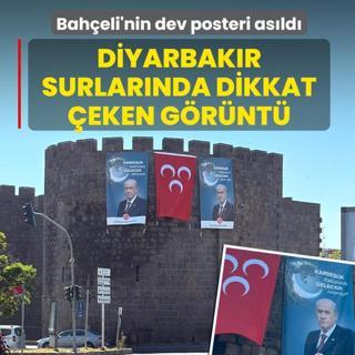 Diyarbak�r surlar�nda dikkat �eken g�r�nt�! Bah�eli'nin dev posteri as�ld�